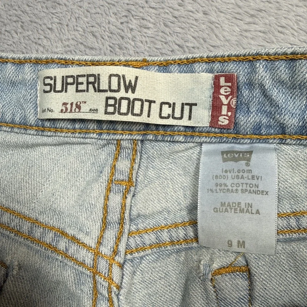 Vintage Levi's 518 Superlow Bootcut Jeans 31x31 Blue Light Wash Low Rise Stained